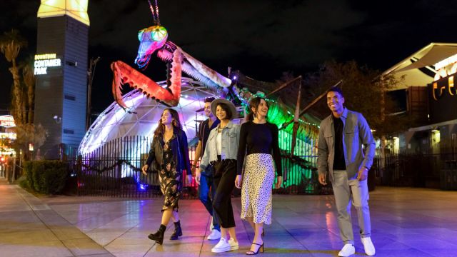 A group of friends walking in Downtown Container park in Las Vegas.
