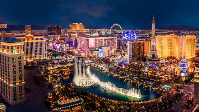 Aerial view of the Las Vegas Strip at night with the Fountains of Bellagio display on.