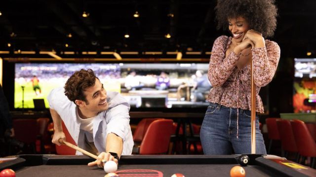 Two people playing pool in Las Vegas