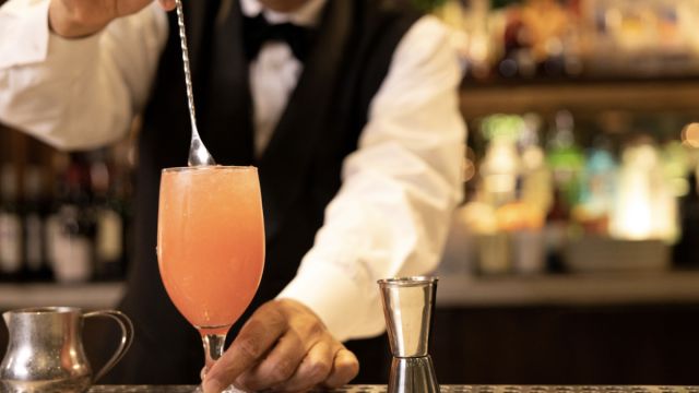 A bartender stirring a delicious looking drink!