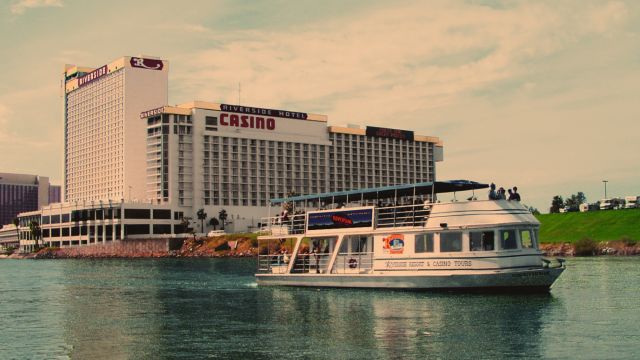 The USS Riverside floats past the Riverside Resort Hotel & Casino in Laughlin, NV