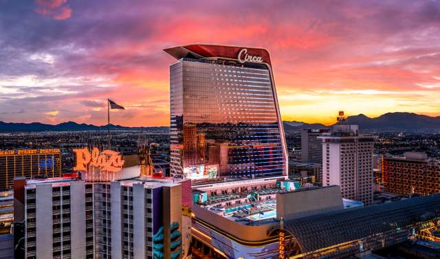 Beautiful lights of Las Vegas seen from a distance focusing in on Circa and stadium swim.