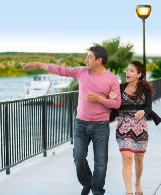 A couple enjoying a walk at Laughlin River Walk.