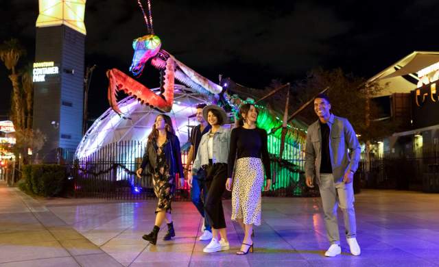 A group of friends walking in Downtown Container park in Las Vegas.