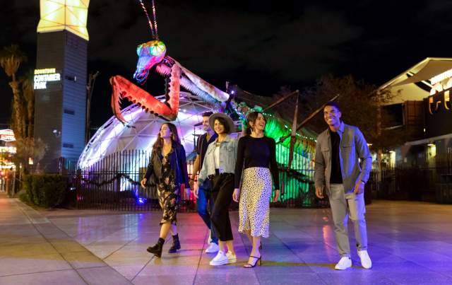 A group of friends walking in Downtown Container park in Las Vegas.
