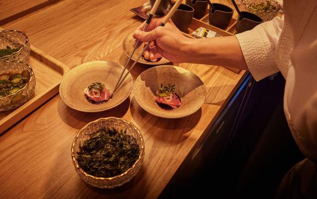 Chef plating sashimi dish at ITO at Fontainebleau Las Vegas.