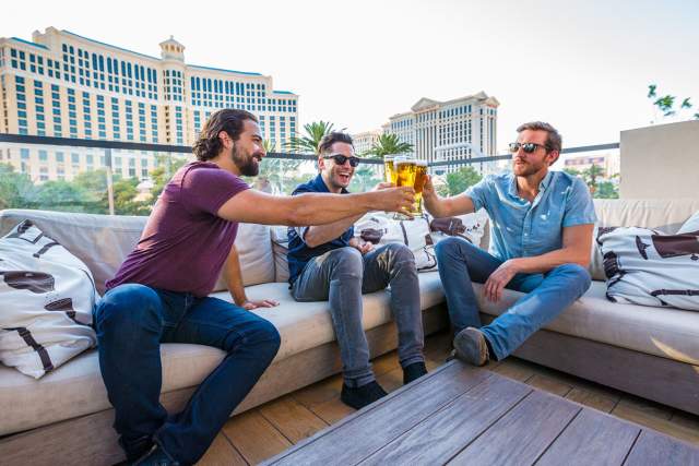 Three guys enjoying a beer at Beer Park at Paris Las Vegas.