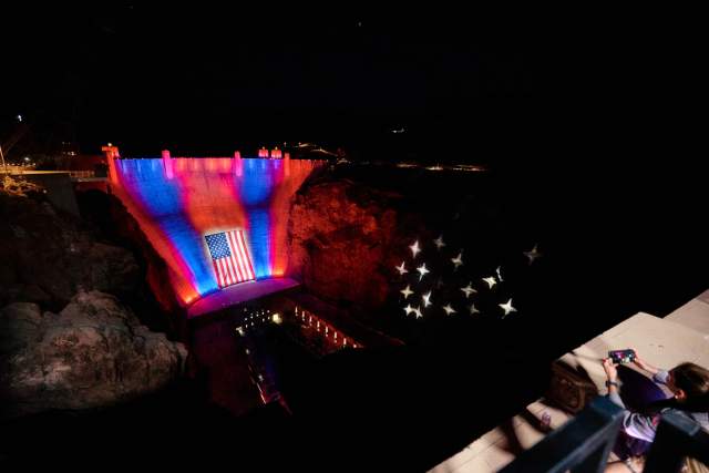 American Flag on Hoover Dam at night