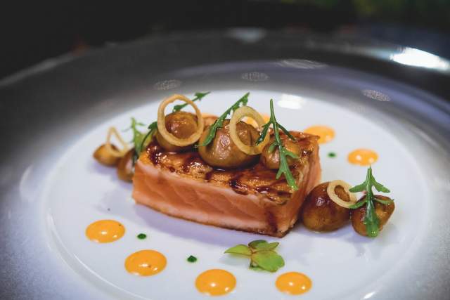 Joël Robuchon glazed salmon dish with mushrooms and citrus purée.
