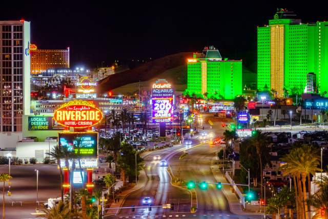A view of the Laughlin Strip at night with signs lit up.