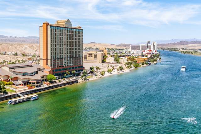 A view of the Laughlin River Lodge Hotel & Casino with the Colorado River in front.