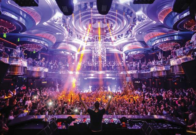 A DJ plays to a huge crowd at OMNIA Nightclub at Caesars Palace.