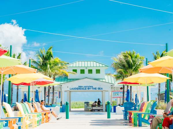Lauderdale-by-the-sea locals enjoy a beautiful sunny day from the comfort of brightly colored Adirondack chairs