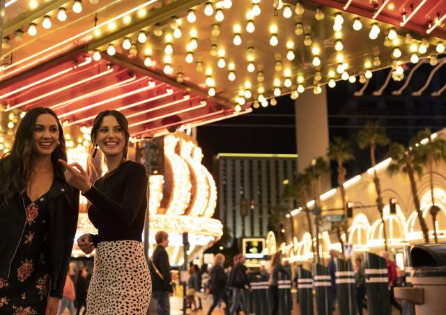 Two women enjoying themselves and having a great time in Downtown Las Vegas.