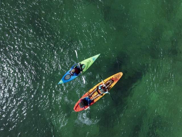 Bird's eye view of people kayaking in the Colorado River in Laughlin, Nevada.