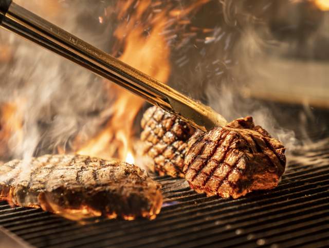 Steaks on a flaming hot grill in Las Vegas