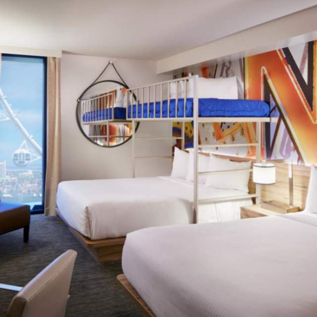 Check out the modern and spacious interior of a hotel suite with bunk beds, perfect for a family, at The LINQ Hotel + Experience.