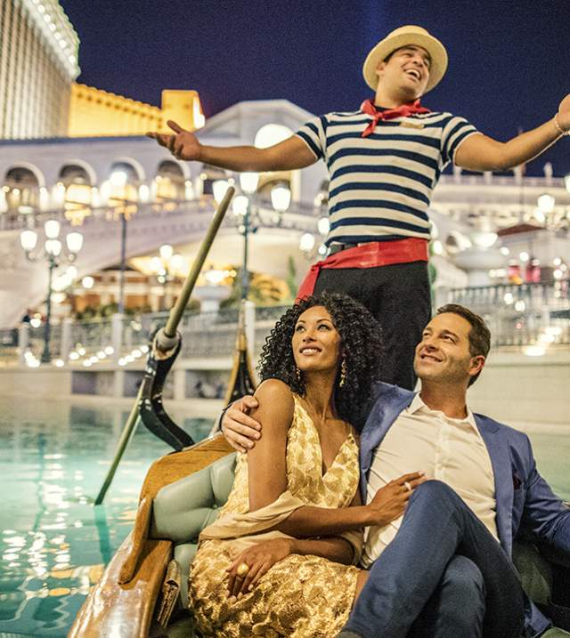 A couple enjoys a gondola ride at The Venetian Resort in Las Vegas