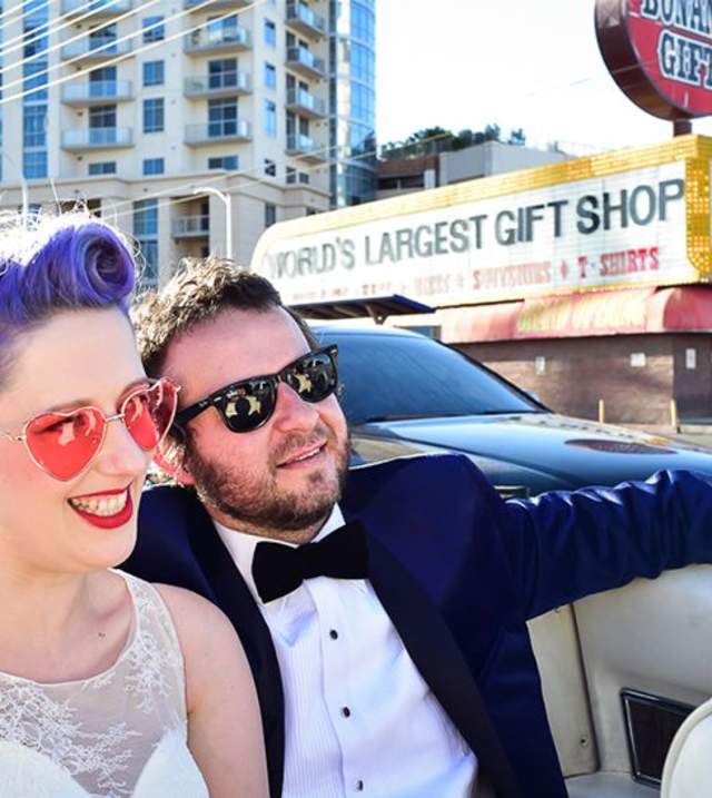 Bride and Groom in a convertible on the Strip