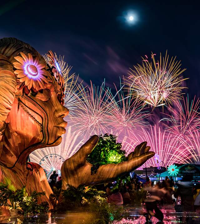 Statue at EDC with fireeworks