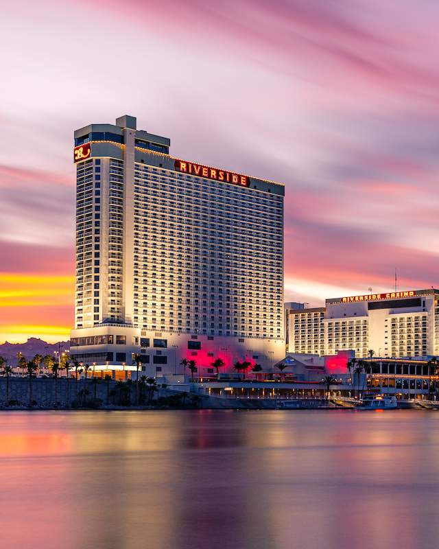 Beautiful sunset reflecting on the Colorado River in front of Don Laughlin's Riverside Casino & Resort.