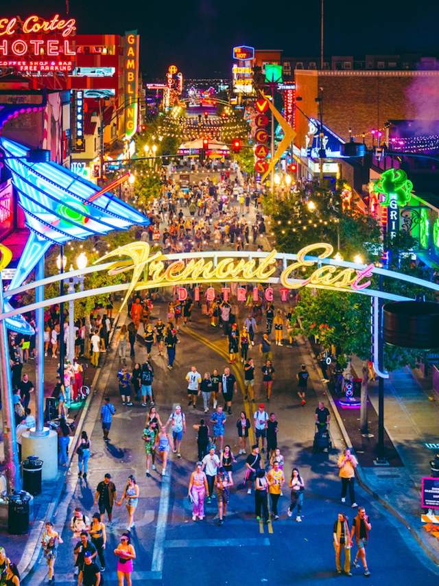 Groups of people walking down Fremont Street in Downtown Las Vegas.