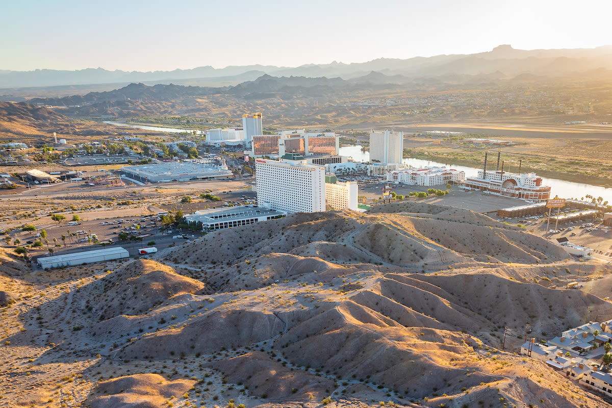 An aerial view of Laughlin with mountains in the background.