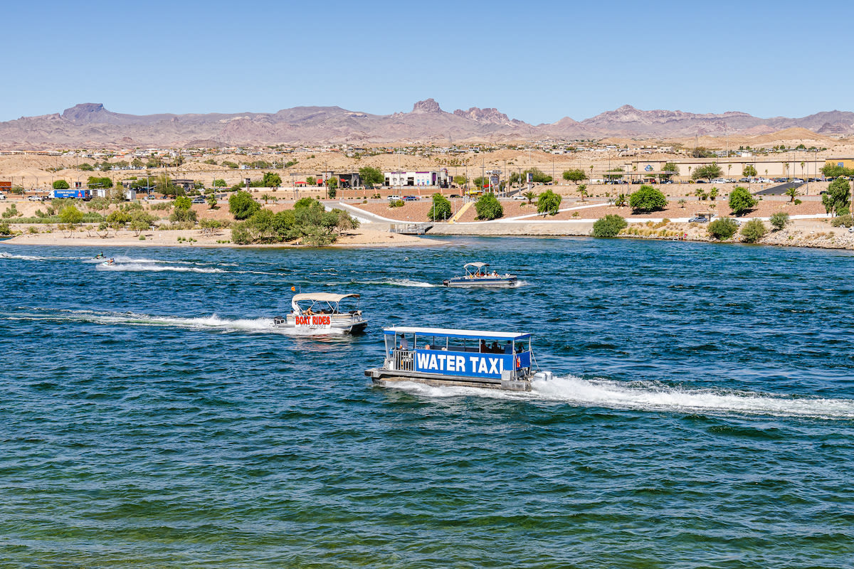 A water taxi on the Colorado River in Laughlin with the mountains in the background.