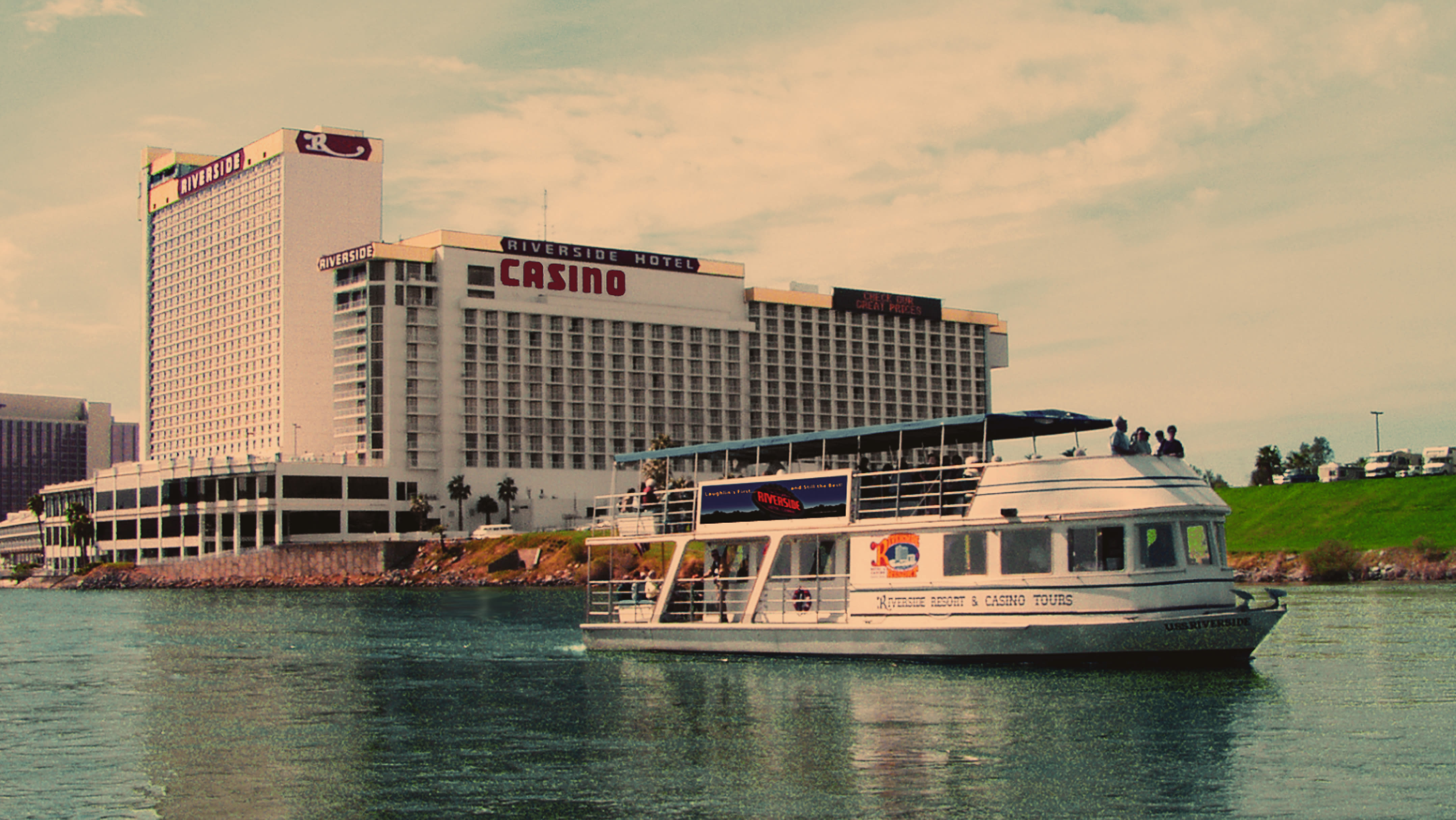 The USS Riverside floats past the Riverside Resort Hotel & Casino in Laughlin, NV