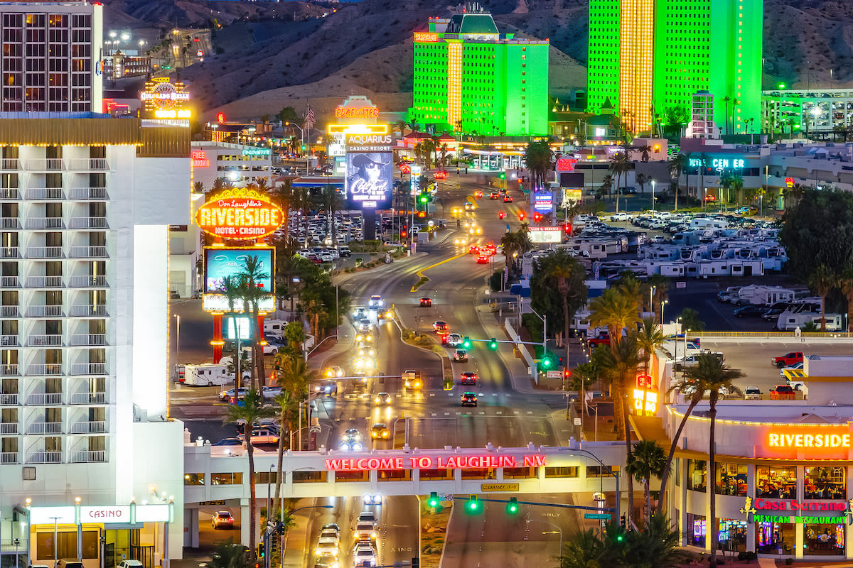 An aerial view of the Welcome to Laughlin sign illuminated at night.