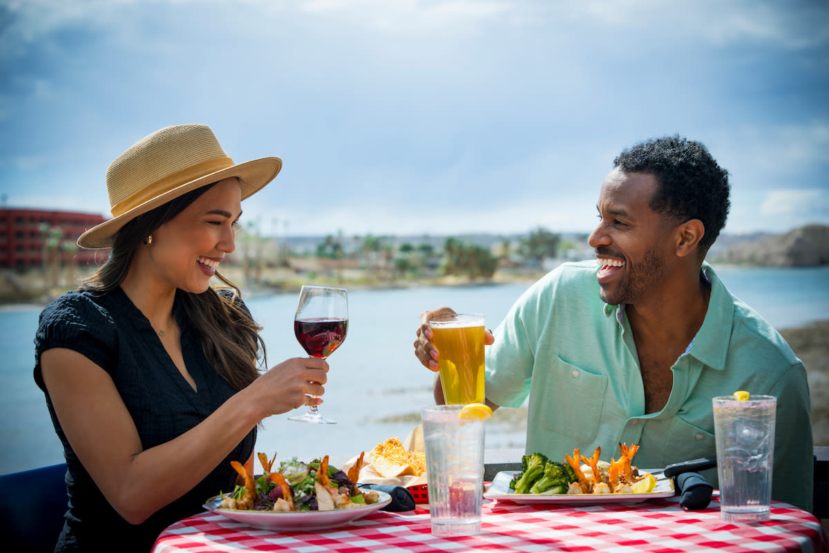 A couple enjoying a delicious meal by the river in Laughlin, Nevada!
