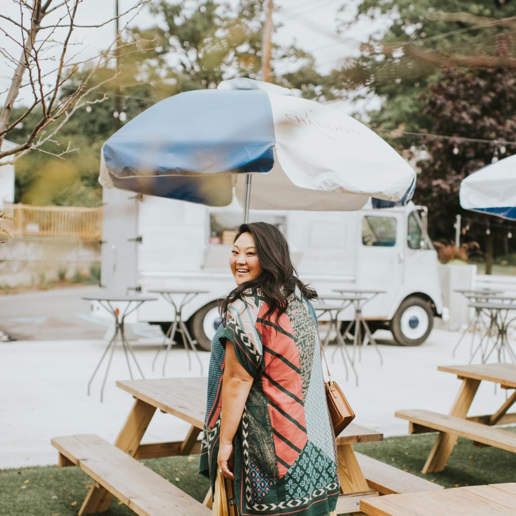 Lady Wearing a fall outfit perfect for exploring around Grand Rapids.