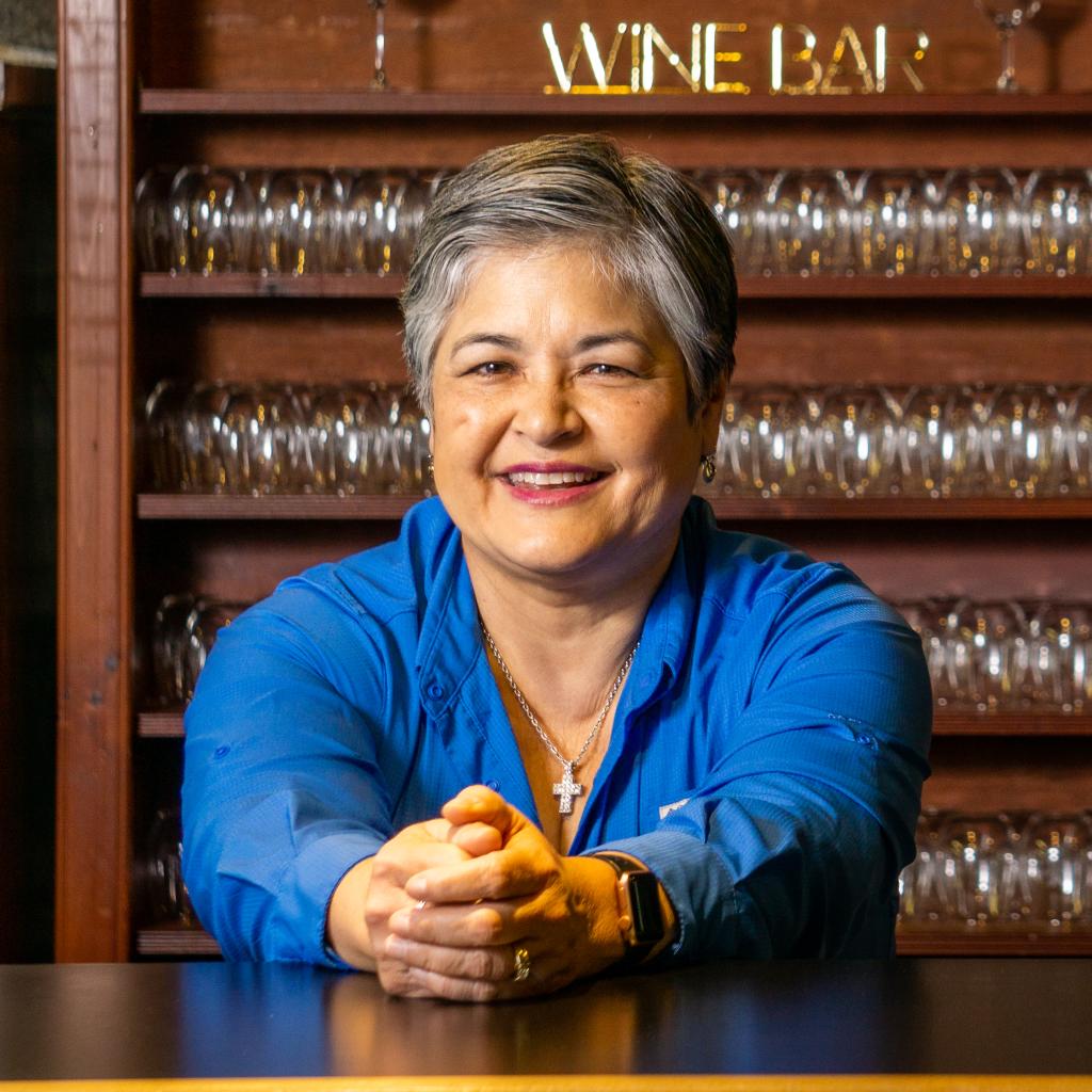 Alicia Robinette standing in the tasting room at Robinette's Apple Haus & Winery