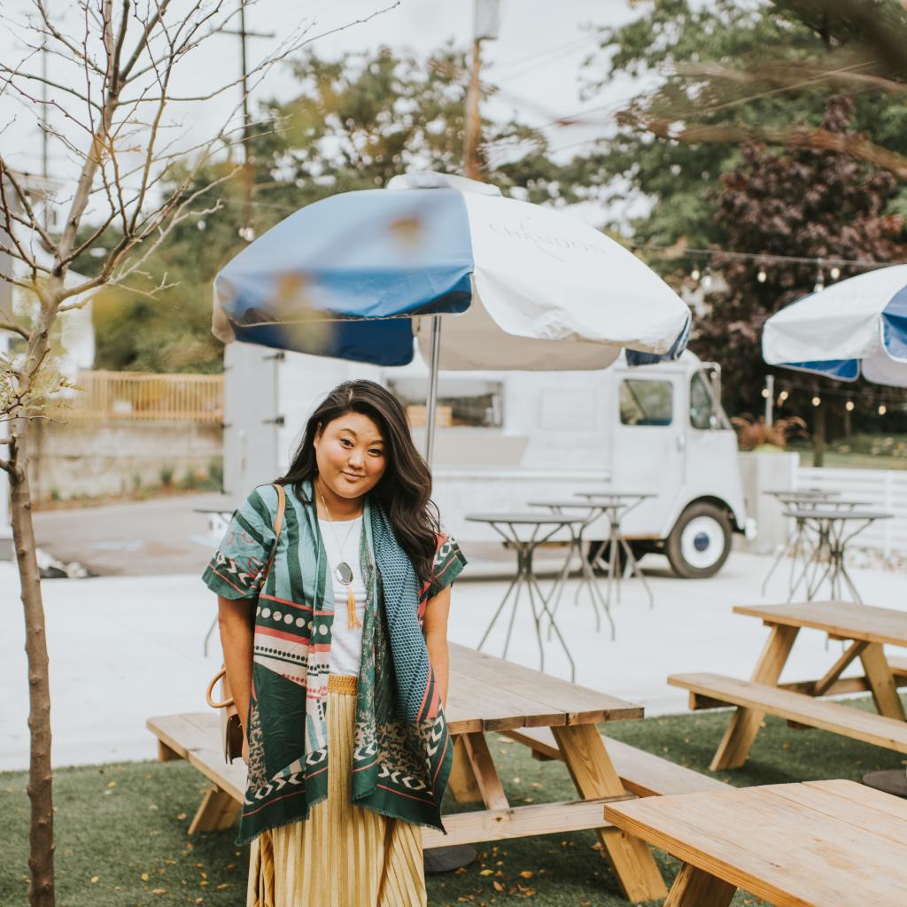 Ashley wearing a fashionable outfit perfect for fall exploring.