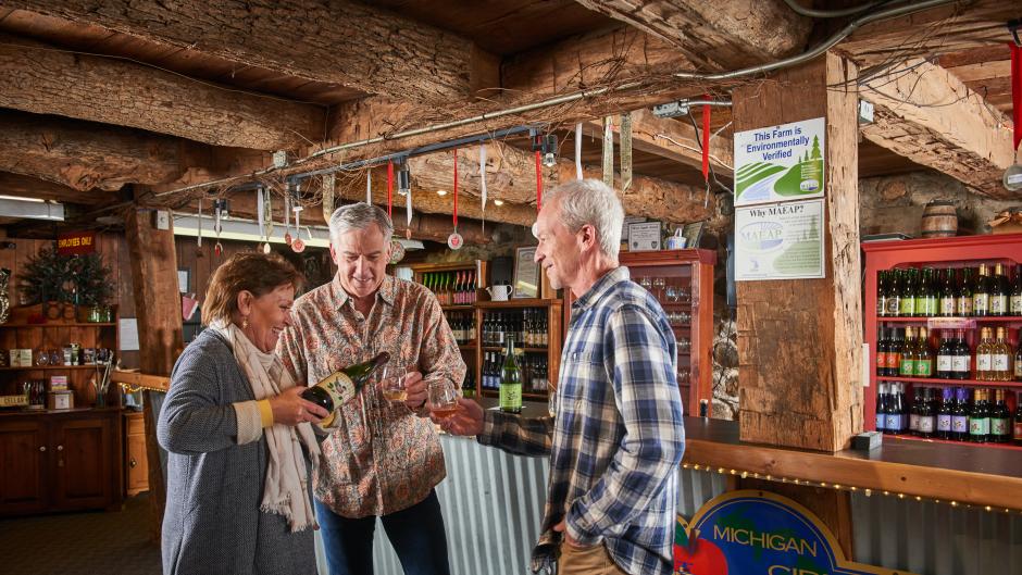 A couple cider tasting at Robinette's Apple Haus & Winery in Grand Rapids