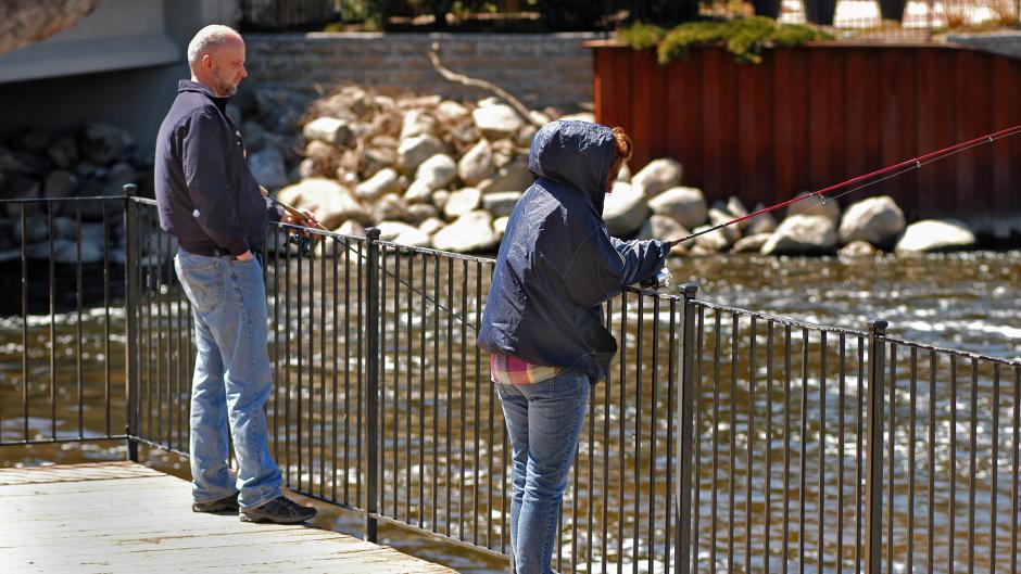Two anglers enjoy a sunny day at the Rogue River.