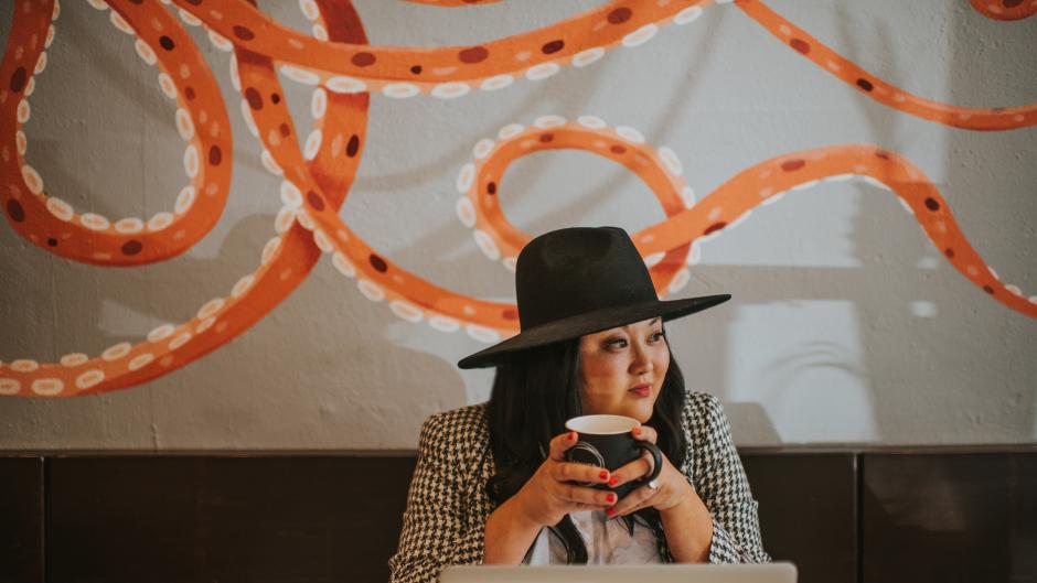 Lady Sipping coffee at Squibb Coffee and Wine Bar