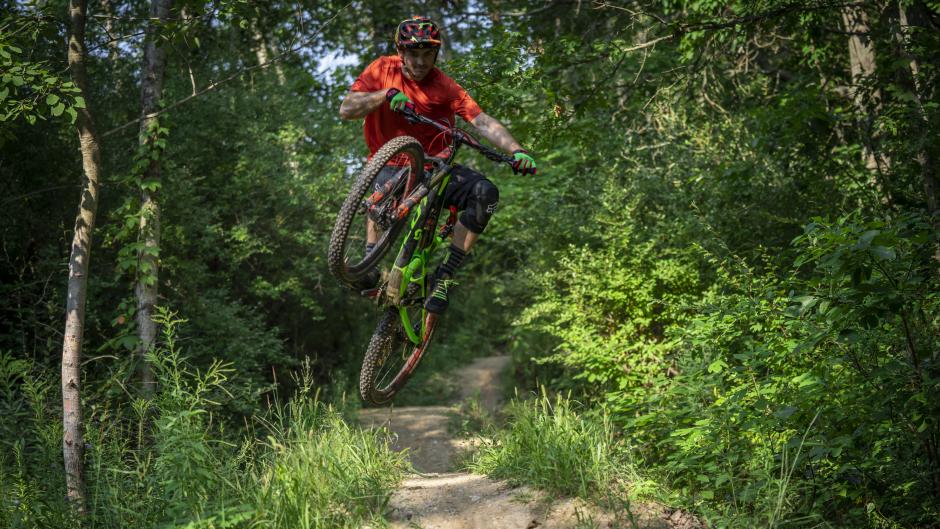 Mountain biker jumping a trail near Grand Rapids