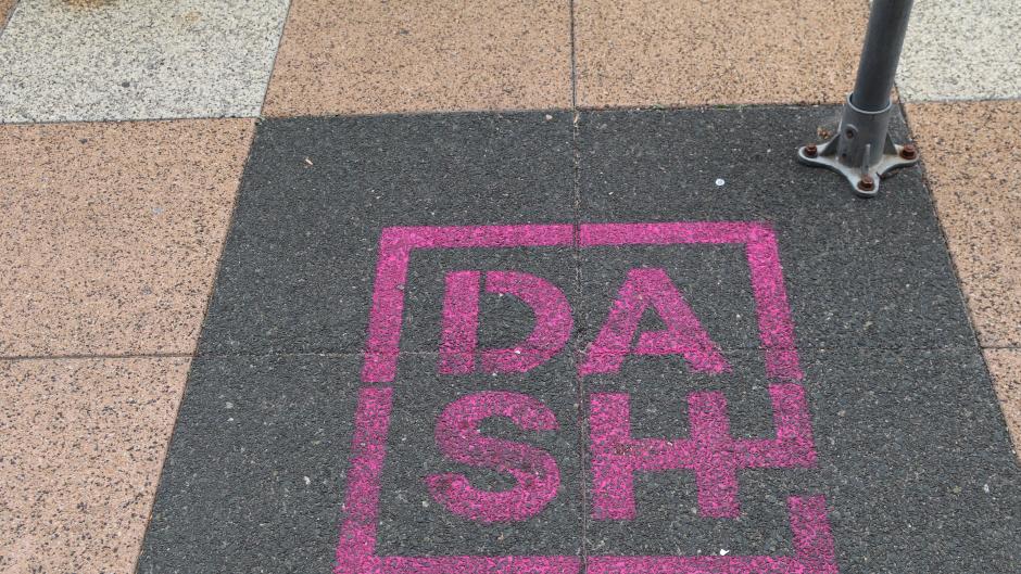 DASH marker on the sidewalk