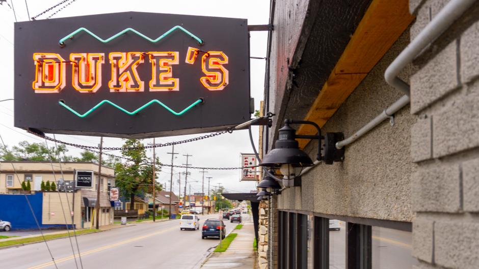 Neon sign in front of Duke's Bar.