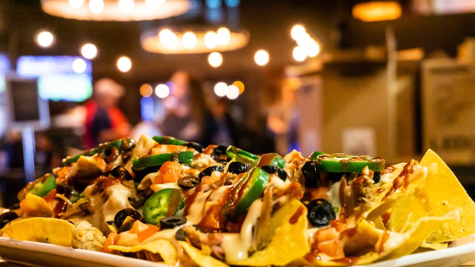 A plate full of nachos at Perrin Brewing Co.