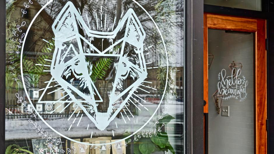 The front of Fox Naturals' shop in Grand Rapids, which has a large design of a fox in the window.