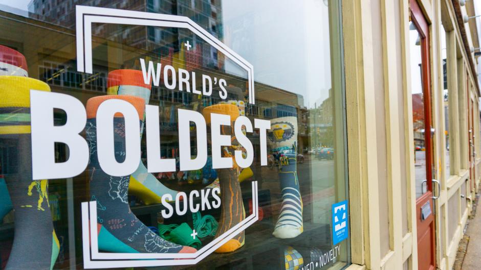 Exterior window of boldSOCKS, which reads, "World's Boldest Socks."