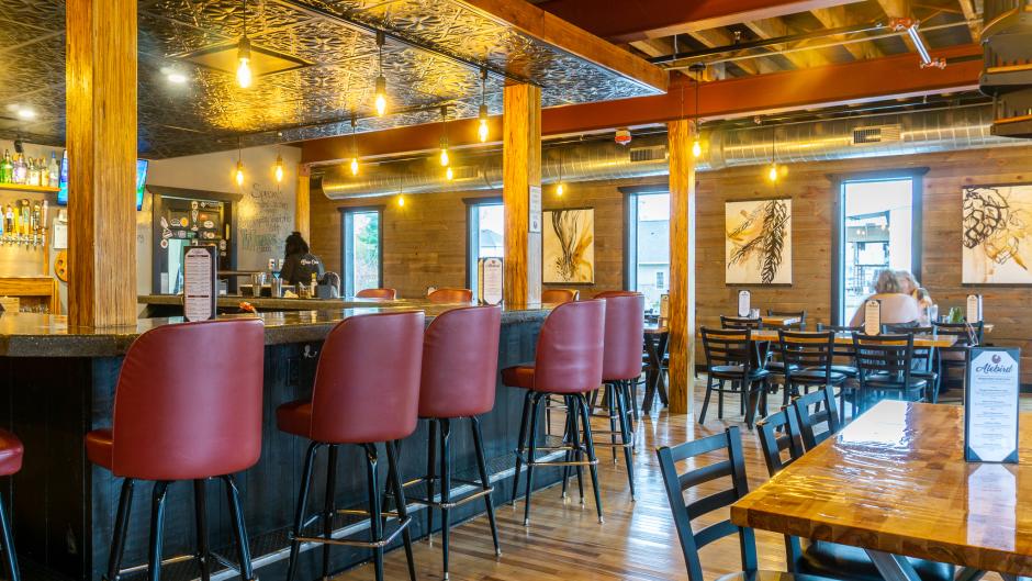 Bar and table seating inside Alebird.