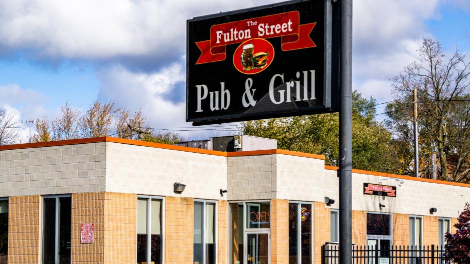 Exterior view of Fulton Street Pub & Grill sign and front entrance.