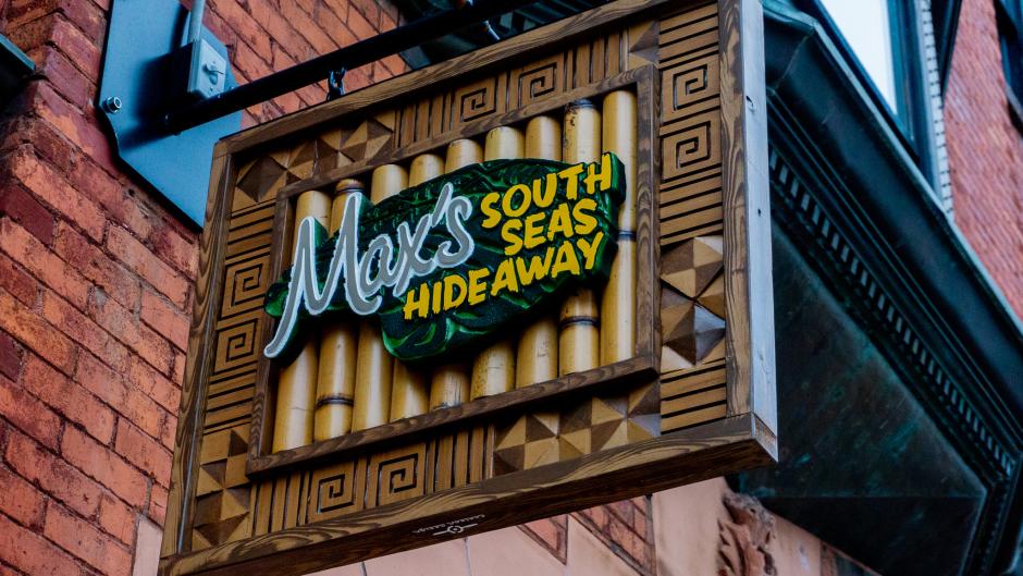 Outdoor sign attached to Max's South Seas Hideaway.