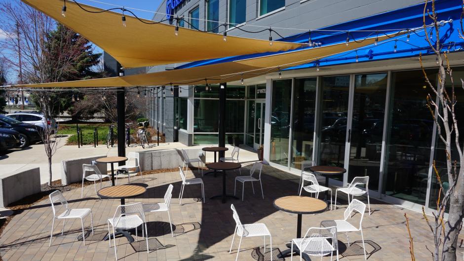 Enjoy your coffee drink under Ferris Coffee's outdoor canopies and string lights.