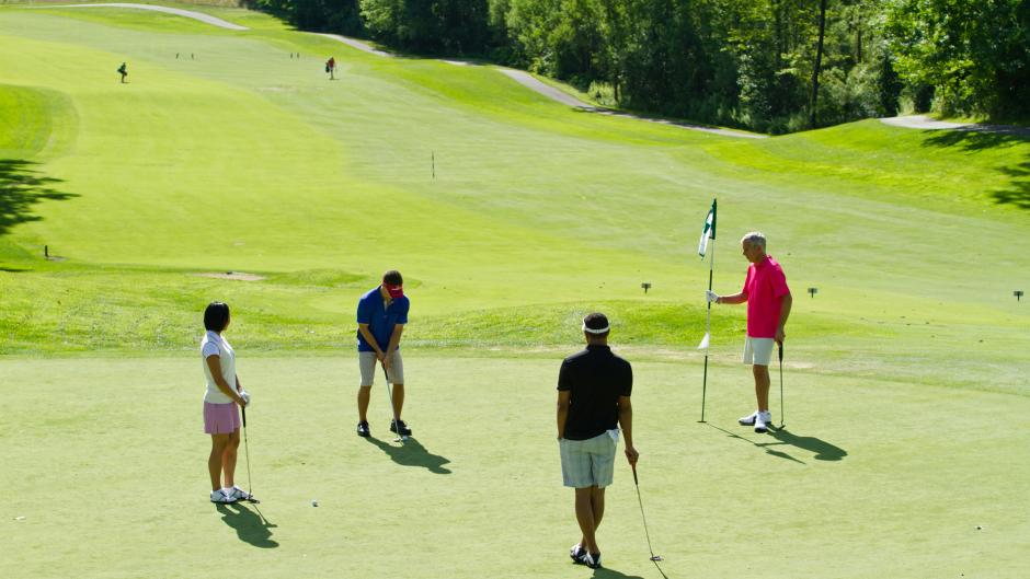 Four Golfers on the Putting Green