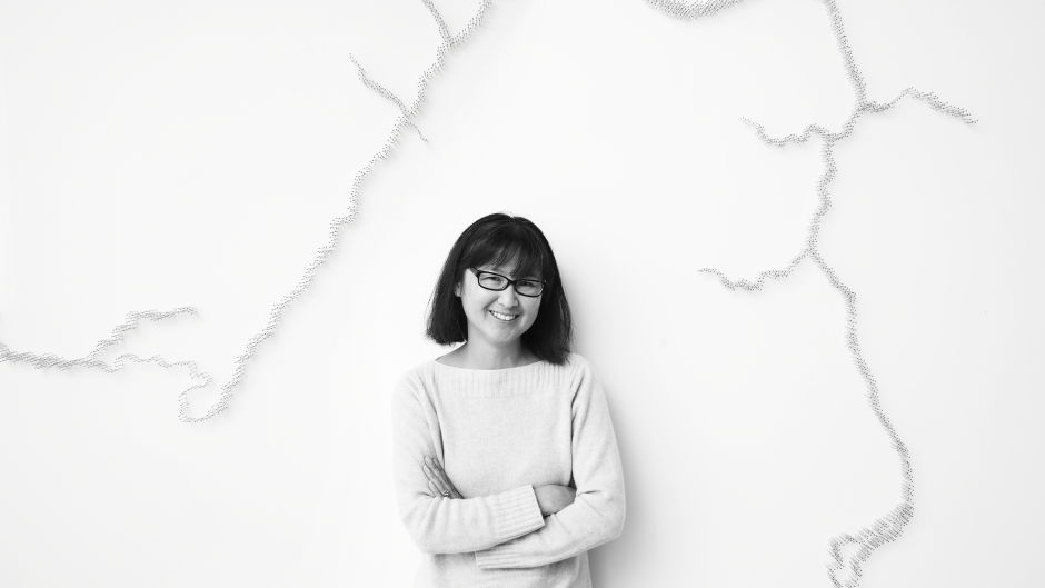 Maya Lin in front of her work, Pin River -- Grand River Watershed (detail).