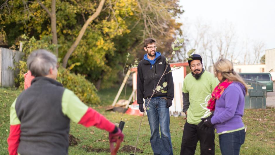Planting trees at South End Community Outreach Ministries.